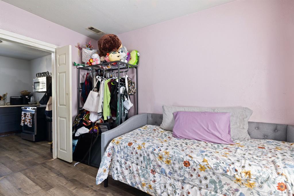 301 South Morrow Street Blue Ridge, TX 75424 - Photo 17 of 30 a bedroom with a bed and a view of bathroom