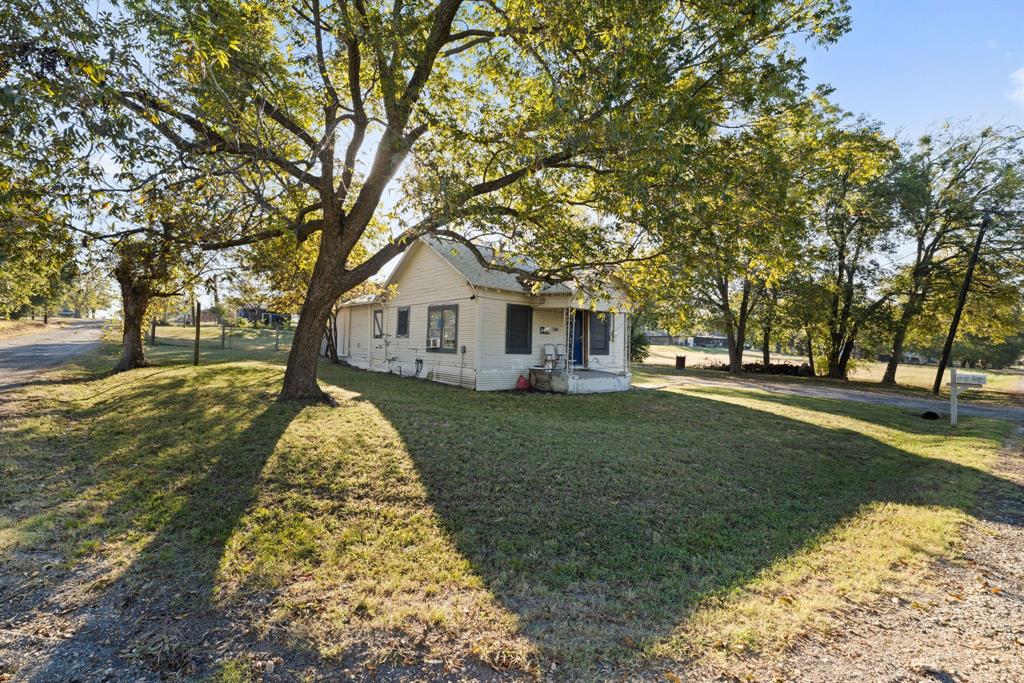 301 South Morrow Street Blue Ridge, TX 75424 - Photo 2 of 30 a view of a house with a yard