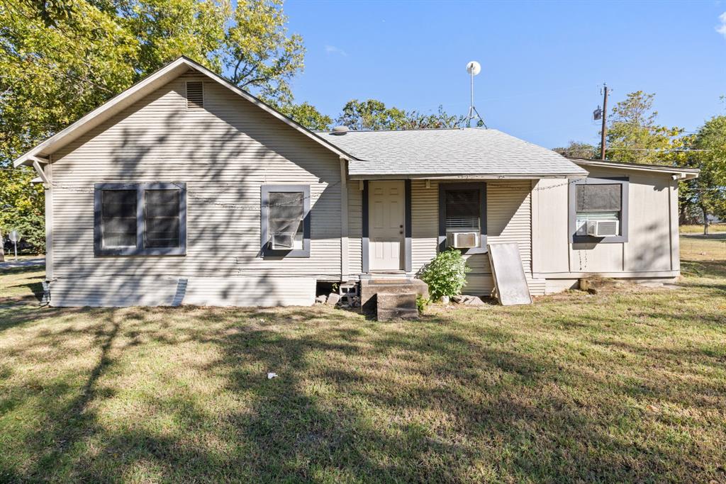 301 South Morrow Street Blue Ridge, TX 75424 - Photo 22 of 30 a view of a house with backyard and a tree