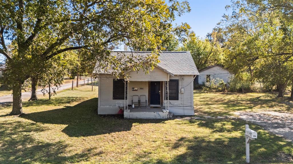 301 South Morrow Street Blue Ridge, TX 75424 - Photo 25 of 30 a view of house with yard
