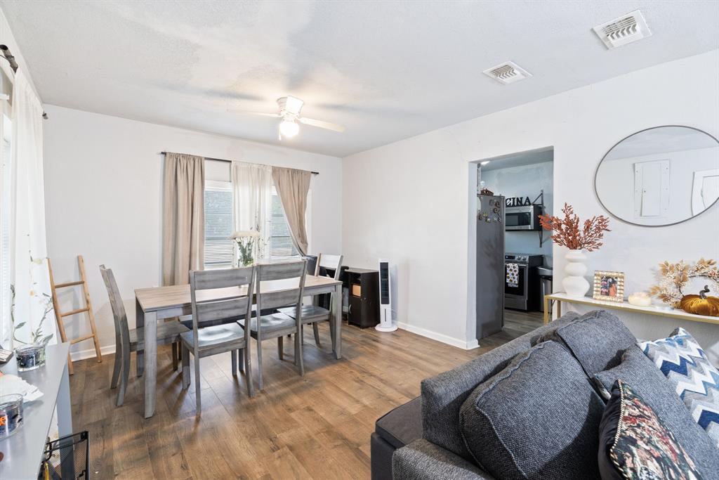 301 South Morrow Street Blue Ridge, TX 75424 - Photo 9 of 30 a view of a dining room with furniture and wooden floor