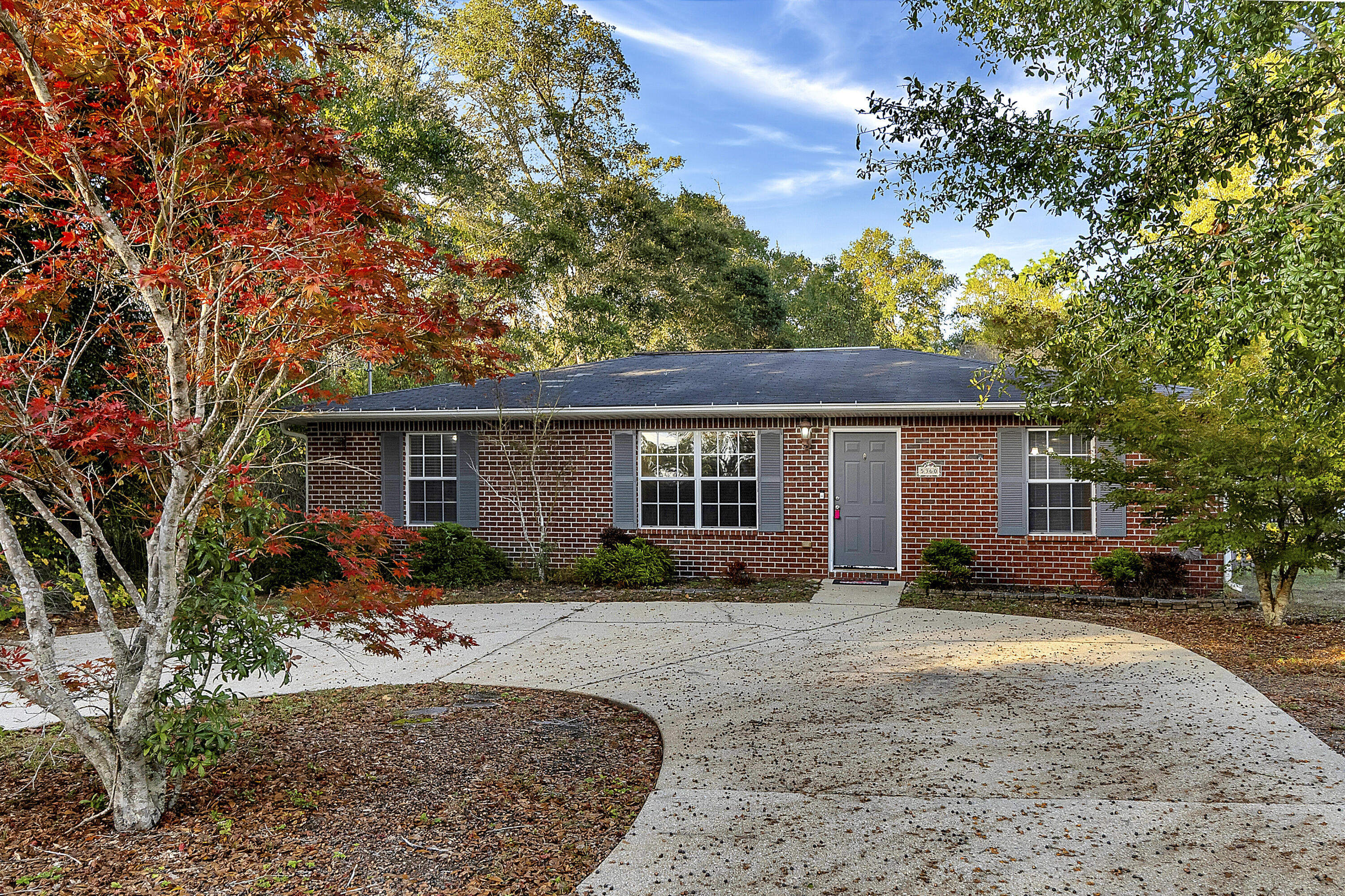 front view of a house with a yard