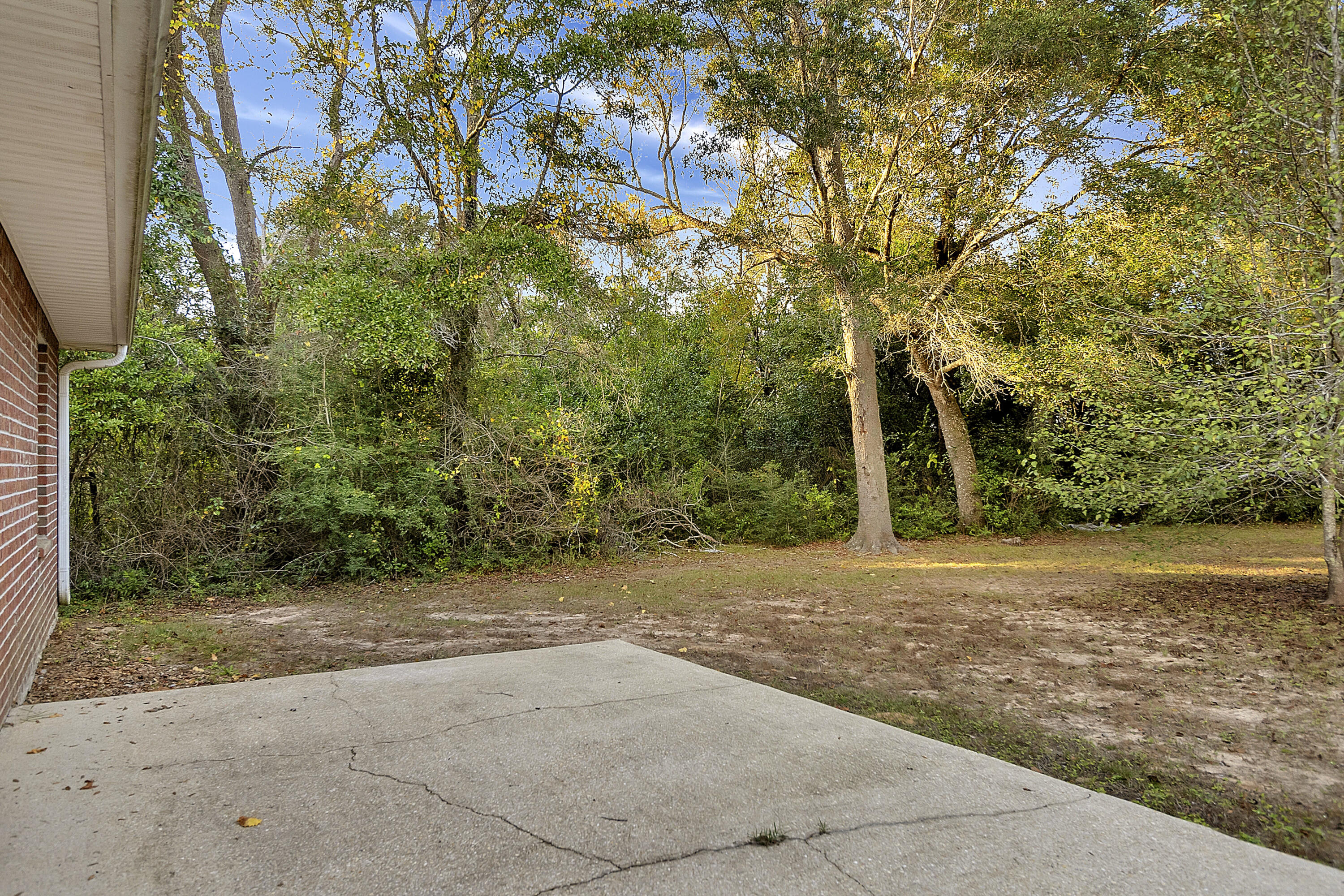 5360 Walker Road Milton, FL 32570 - Photo 15 of 17 a view of a field with a tree