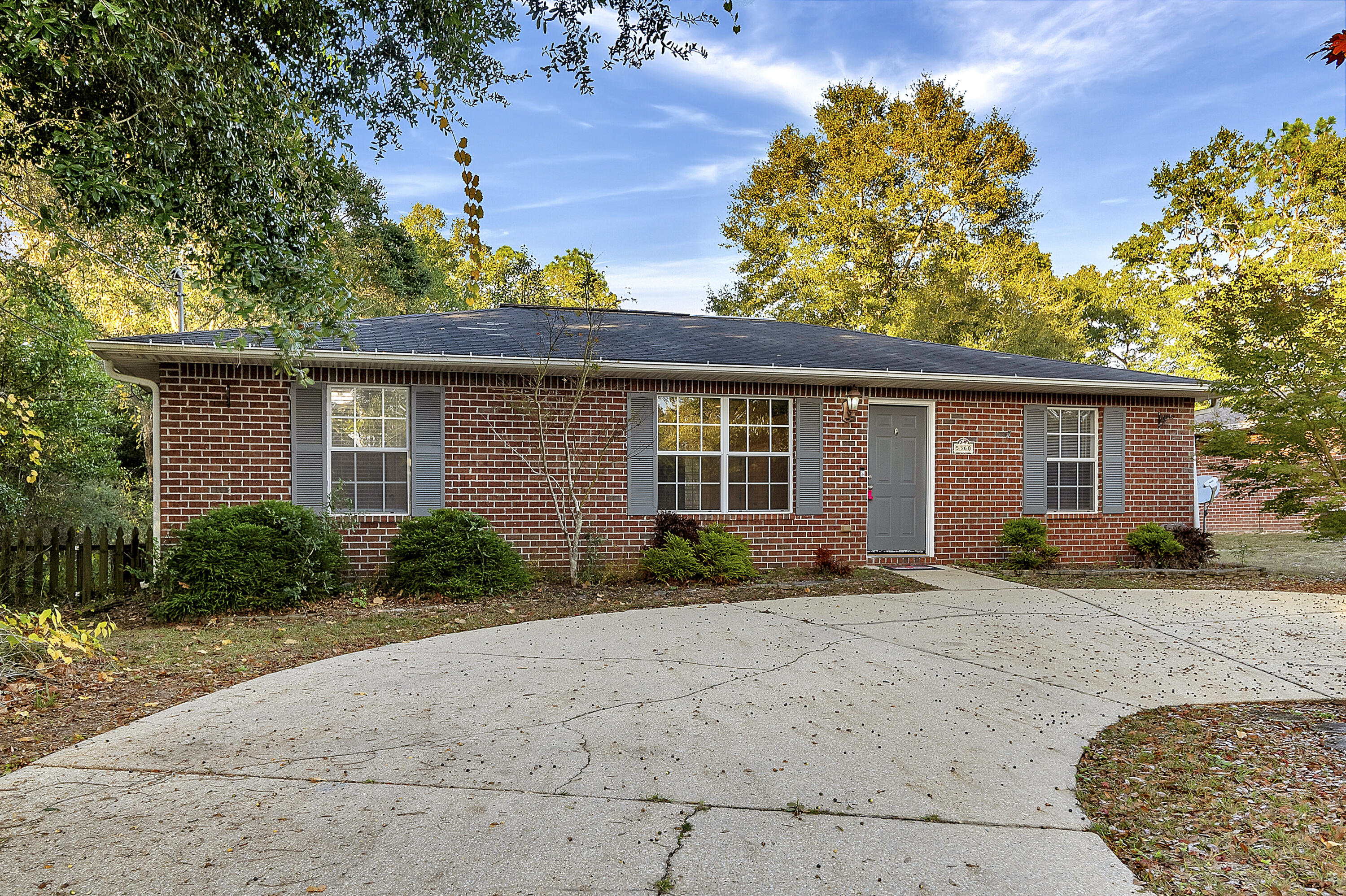 5360 Walker Road Milton, FL 32570 - Photo 2 of 17 front view of a house with a patio