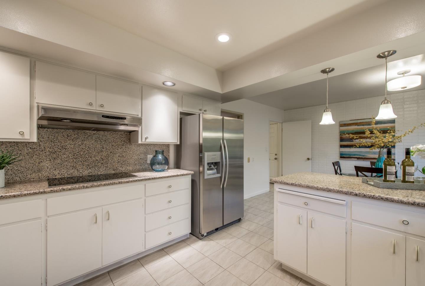 20249 Edinburgh Drive Saratoga, CA 95070 - Photo 13 of 32 a kitchen with lot of cabinets