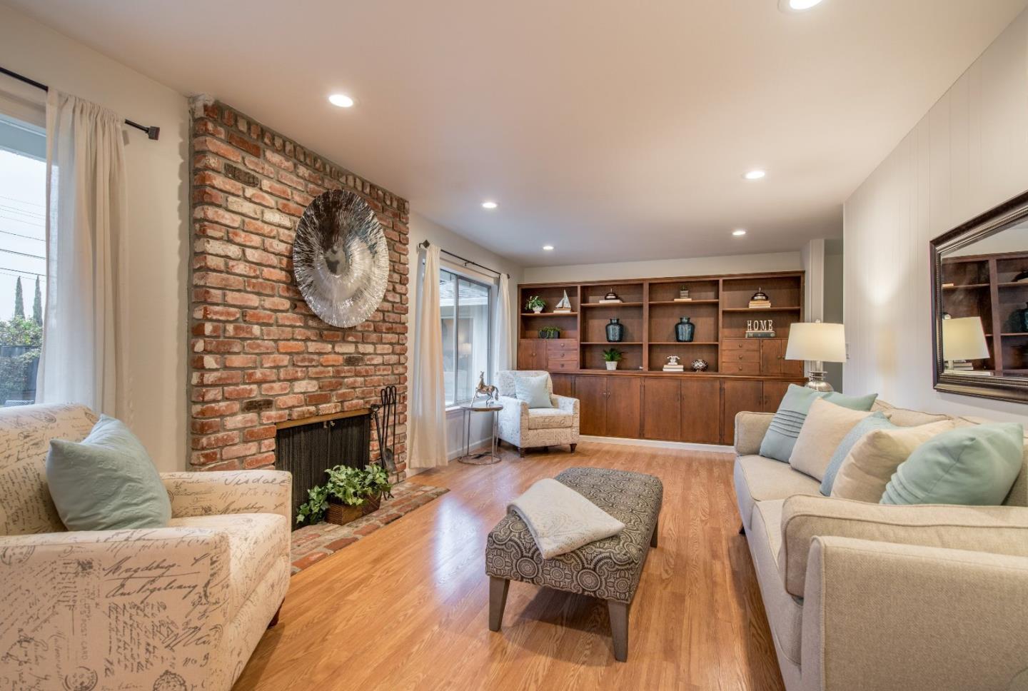 20249 Edinburgh Drive Saratoga, CA 95070 - Photo 14 of 32 a living room with furniture and a fireplace