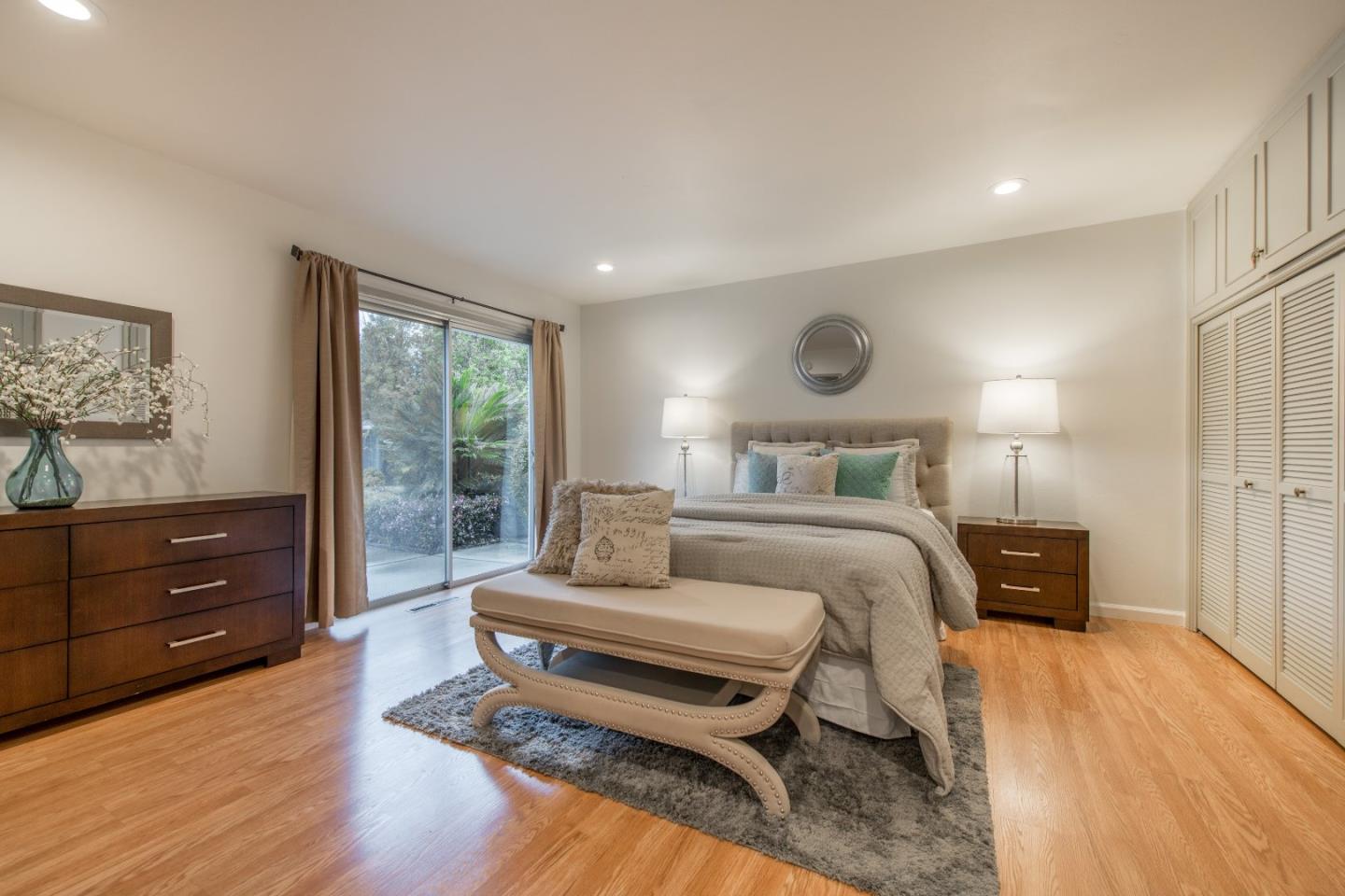 20249 Edinburgh Drive Saratoga, CA 95070 - Photo 16 of 32 a bedroom with a bed and wooden floor
