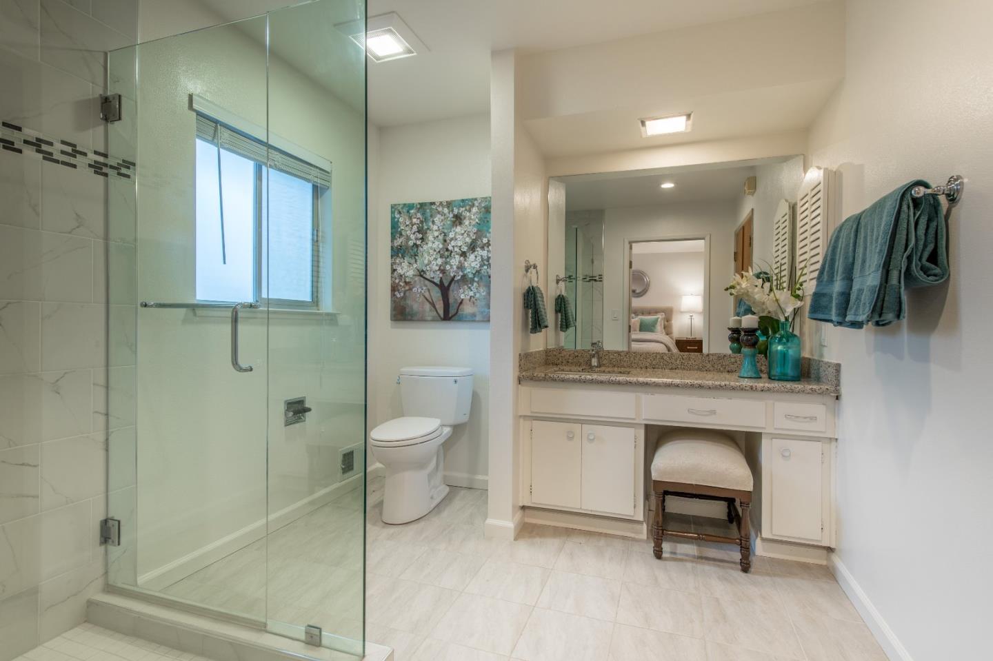 20249 Edinburgh Drive Saratoga, CA 95070 - Photo 17 of 32 a spacious bathroom with a toilet sink and shower