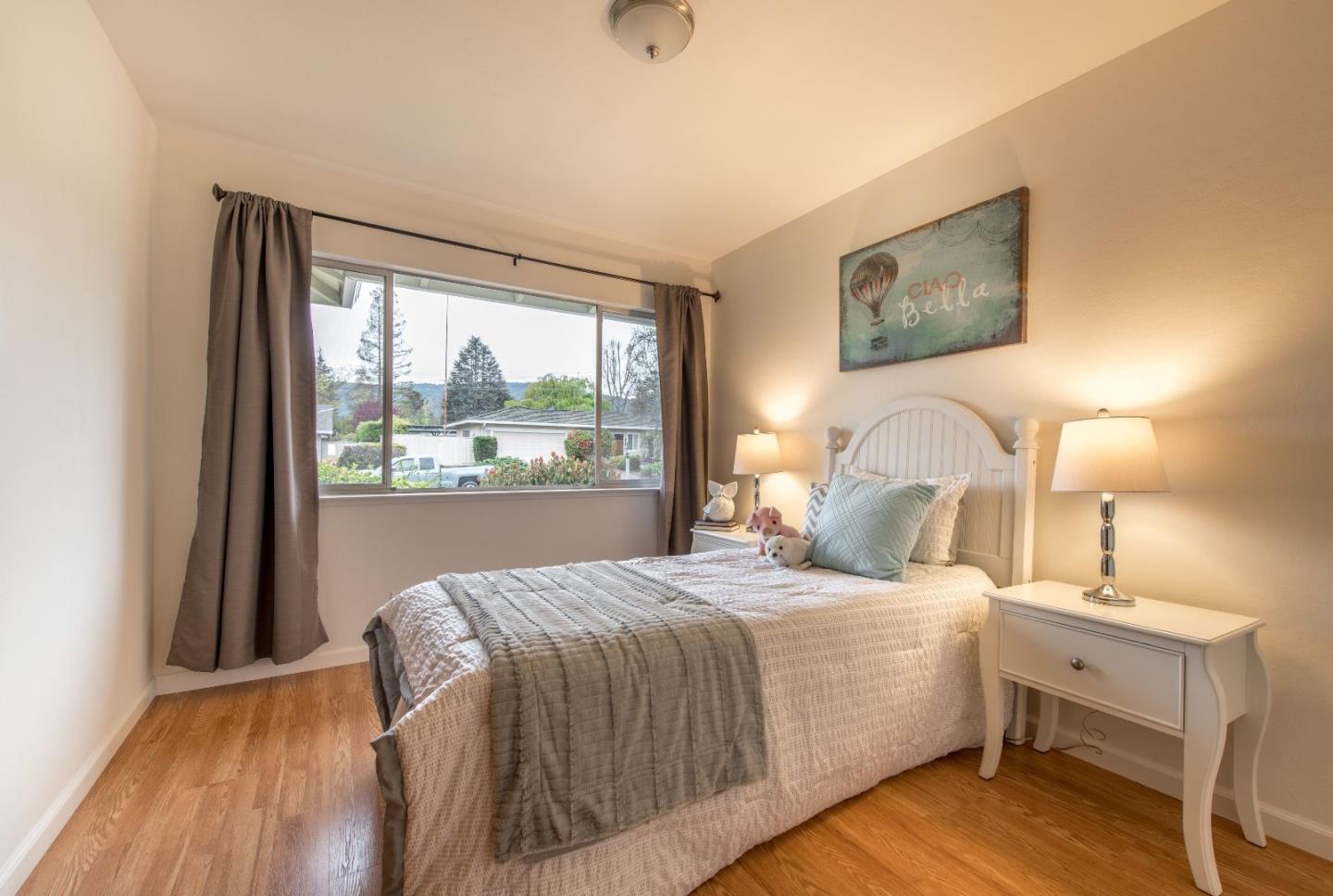 20249 Edinburgh Drive Saratoga, CA 95070 - Photo 18 of 32 a bedroom with a bed and a night stand