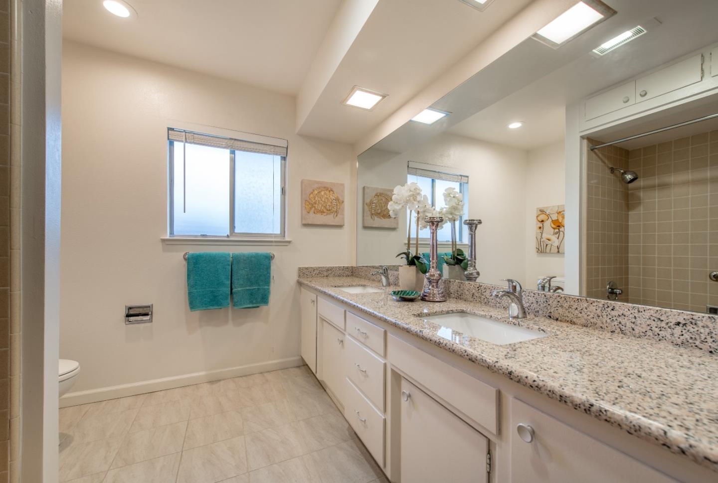 20249 Edinburgh Drive Saratoga, CA 95070 - Photo 20 of 32 a bathroom with a sink and a mirror