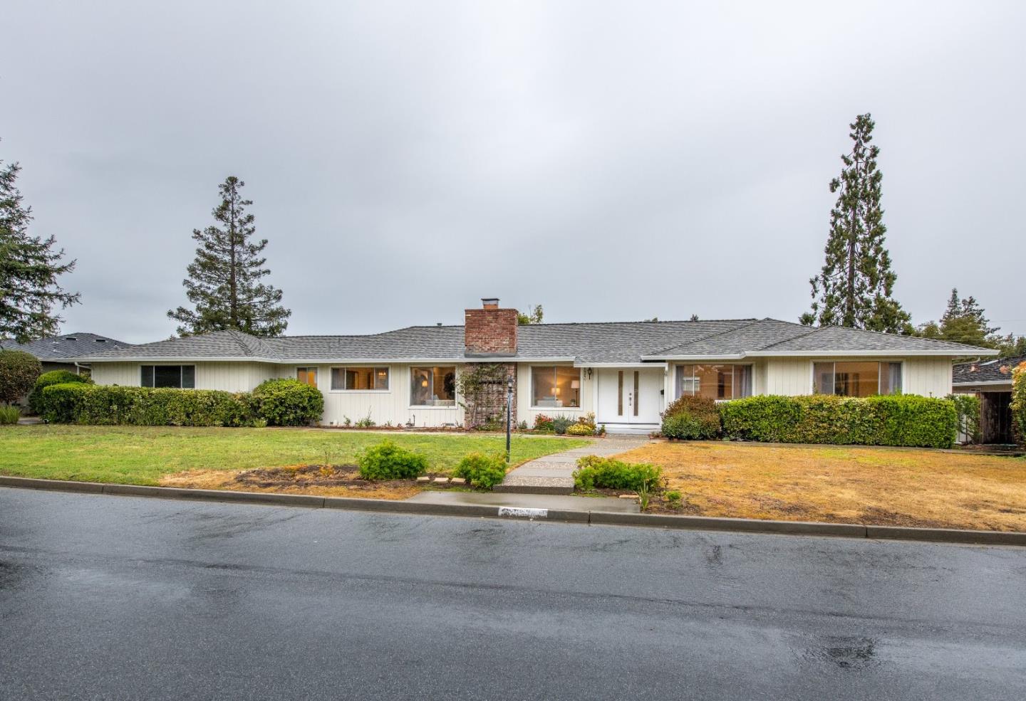 20249 Edinburgh Drive Saratoga, CA 95070 - Photo 2 of 32 a front view of house with yard and green space