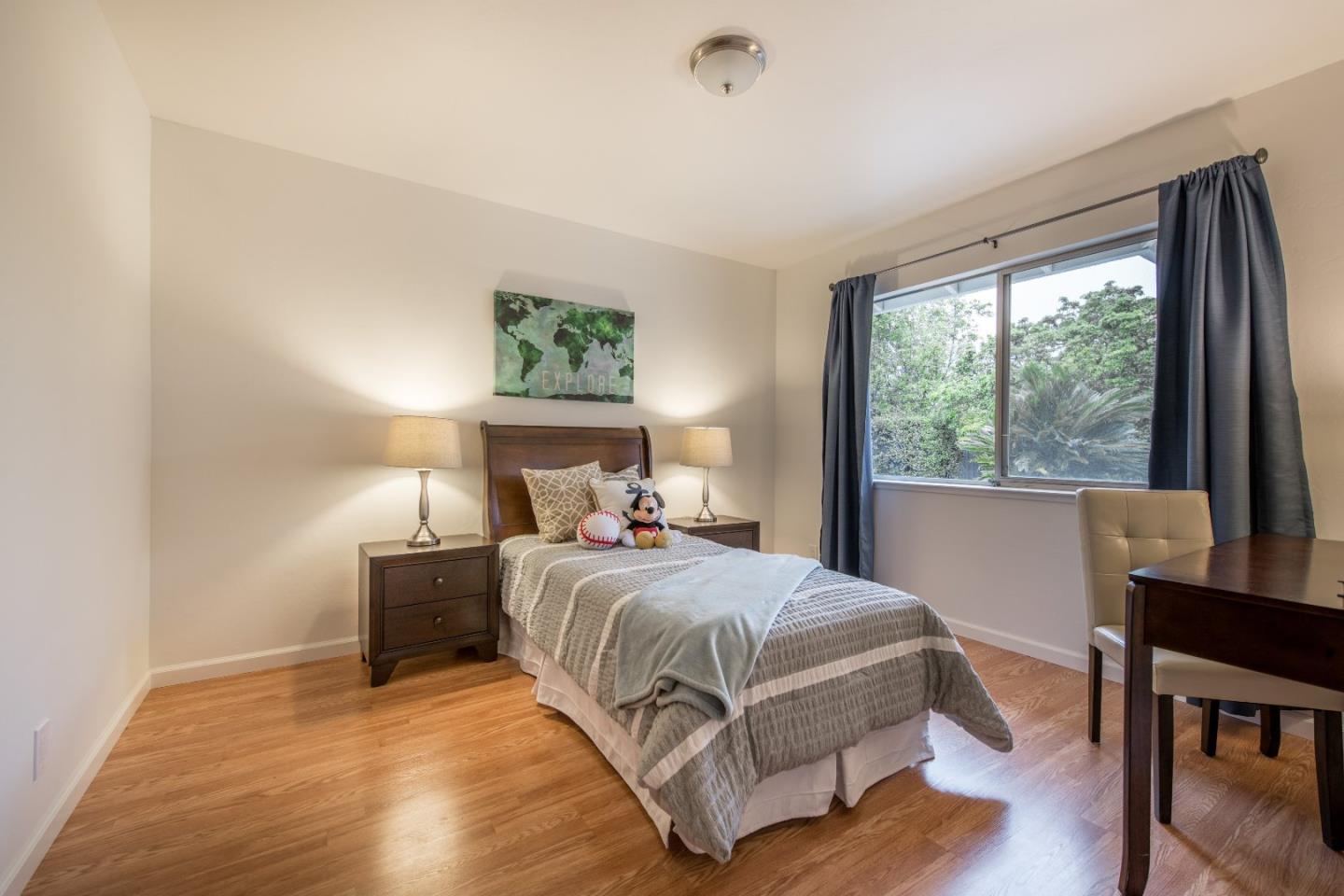 20249 Edinburgh Drive Saratoga, CA 95070 - Photo 21 of 32 a bedroom with a large bed and a window