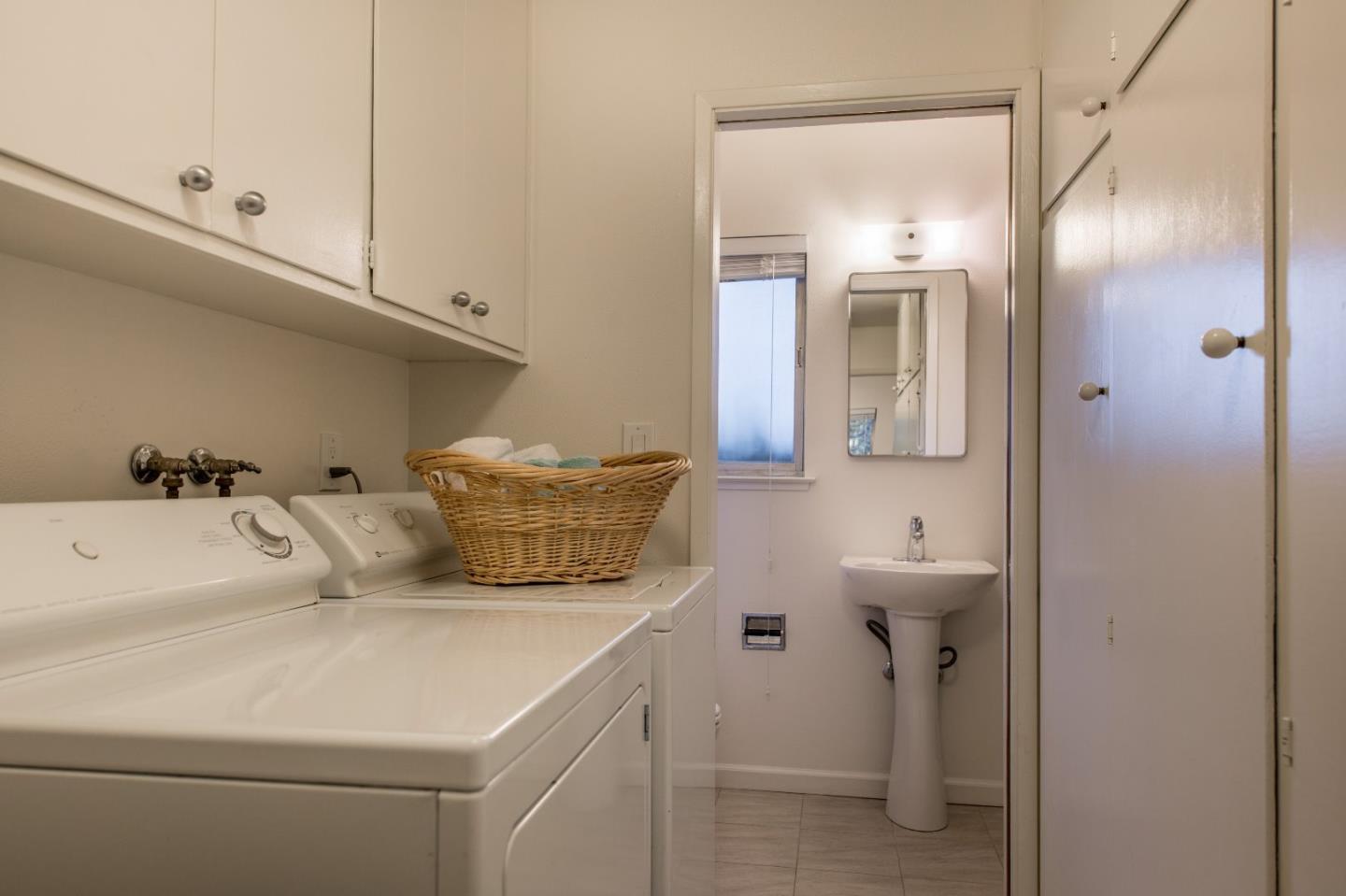 20249 Edinburgh Drive Saratoga, CA 95070 - Photo 22 of 32 a bathroom with a sink and mirror