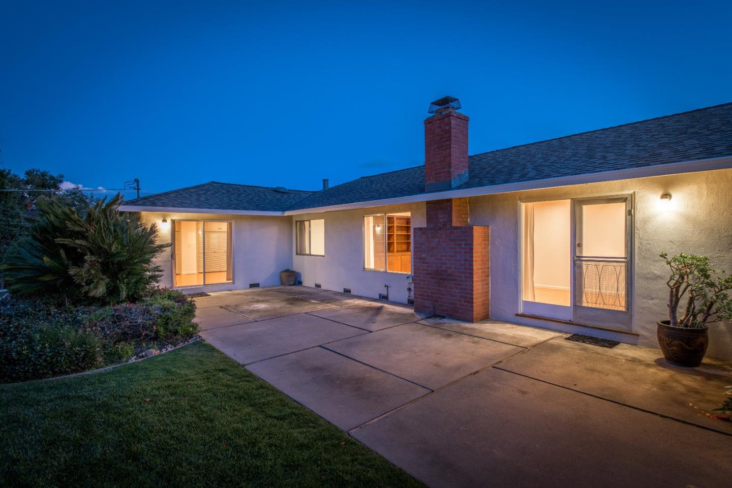 20249 Edinburgh Drive Saratoga, CA 95070 - Photo 24 of 32 a front view of a house with basket ball court and outdoor seating