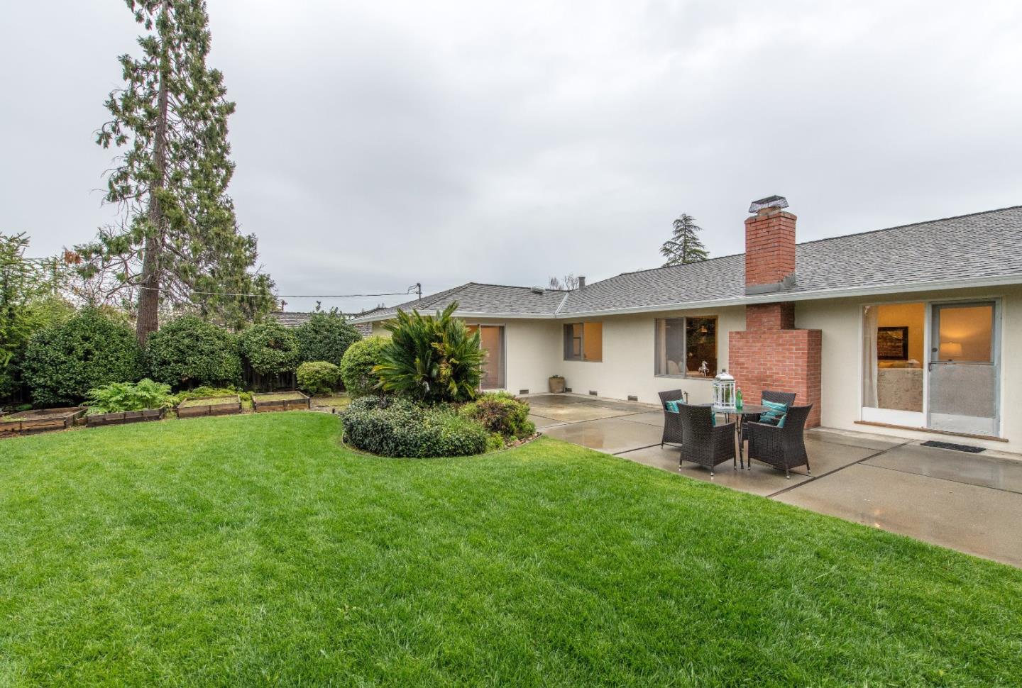 20249 Edinburgh Drive Saratoga, CA 95070 - Photo 25 of 32 a front view of a house with patio and garden