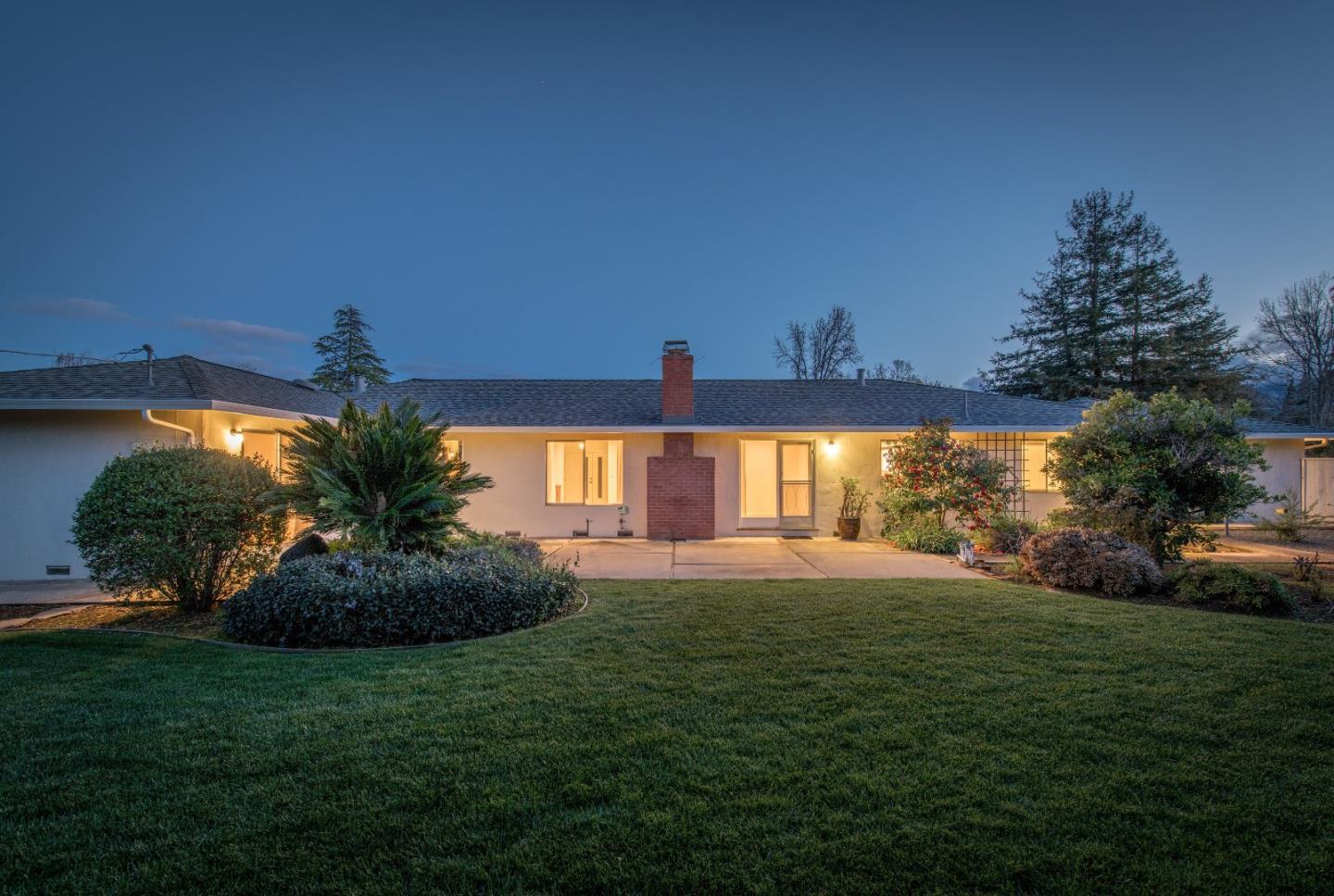 20249 Edinburgh Drive Saratoga, CA 95070 - Photo 29 of 32 a view of a house with a yard and potted plants