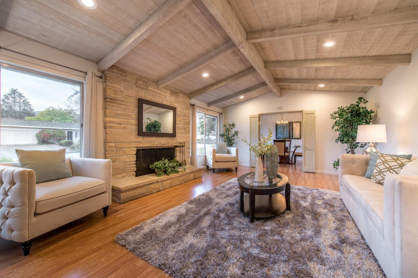 20249 Edinburgh Drive Saratoga, CA 95070 - Photo 6 of 32 a living room with furniture a fireplace and a large window