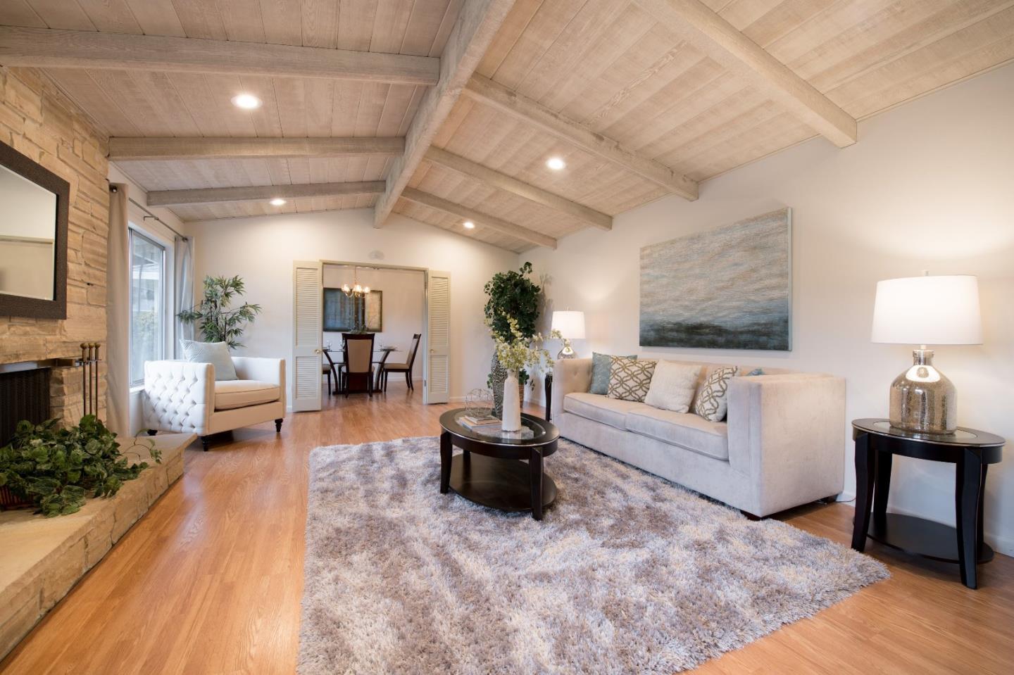 20249 Edinburgh Drive Saratoga, CA 95070 - Photo 7 of 32 a living room with furniture and a table