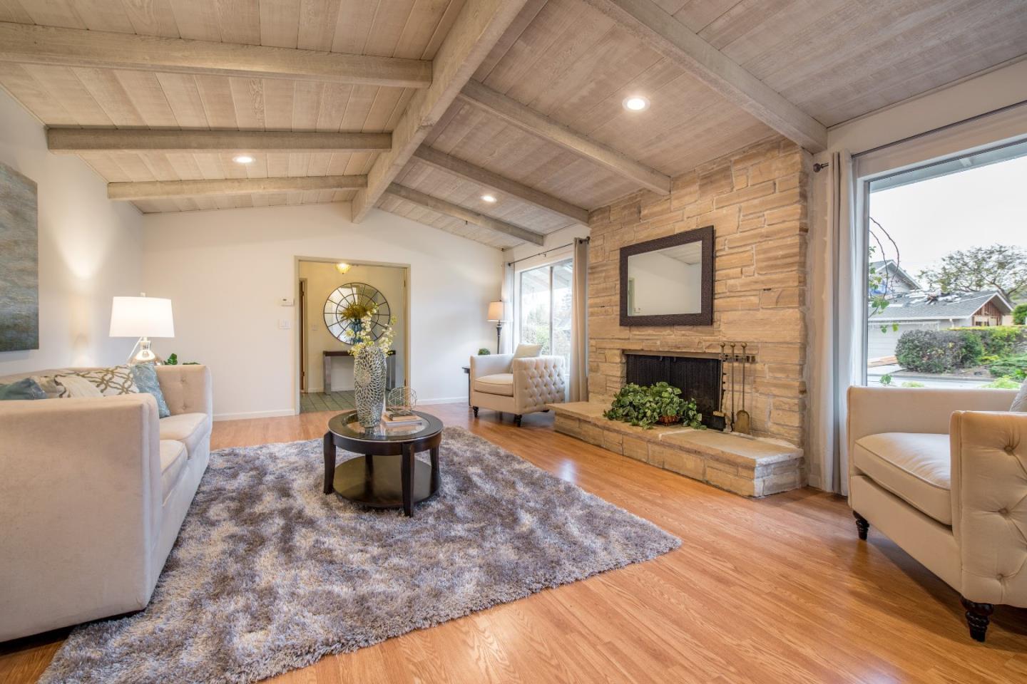 20249 Edinburgh Drive Saratoga, CA 95070 - Photo 8 of 32 a living room with furniture and a fireplace