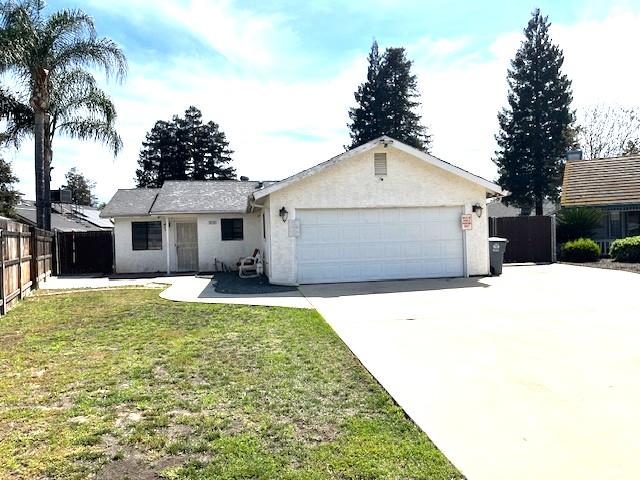 3510 Woodrow Street Selma, CA 93662 - Photo 1 of 4 a front view of a house with a garden