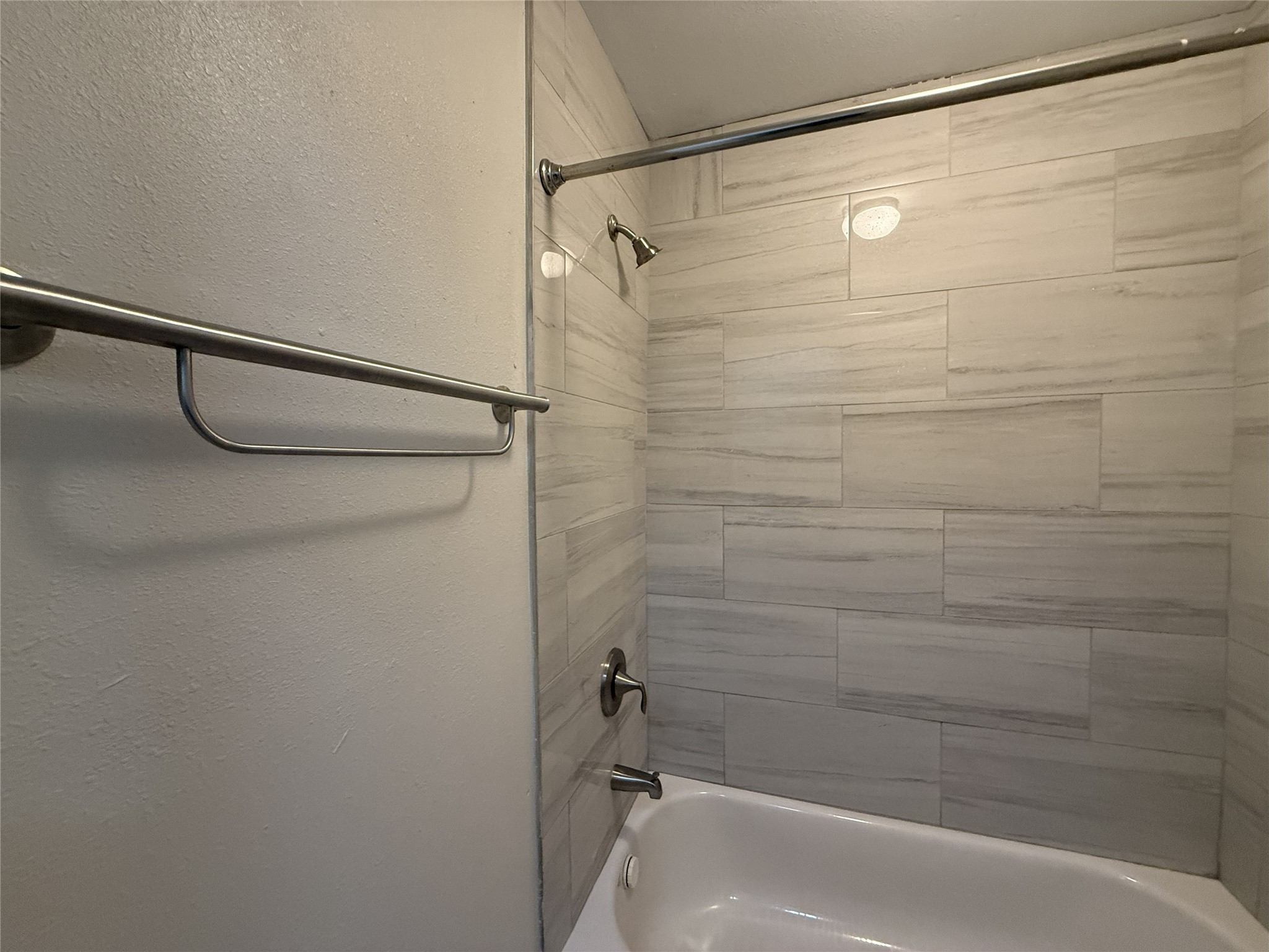 1824 Thonig Road, Unit 10 Houston, TX 77055 - Photo 17 of 17 a bathroom with a shower and a bath tub