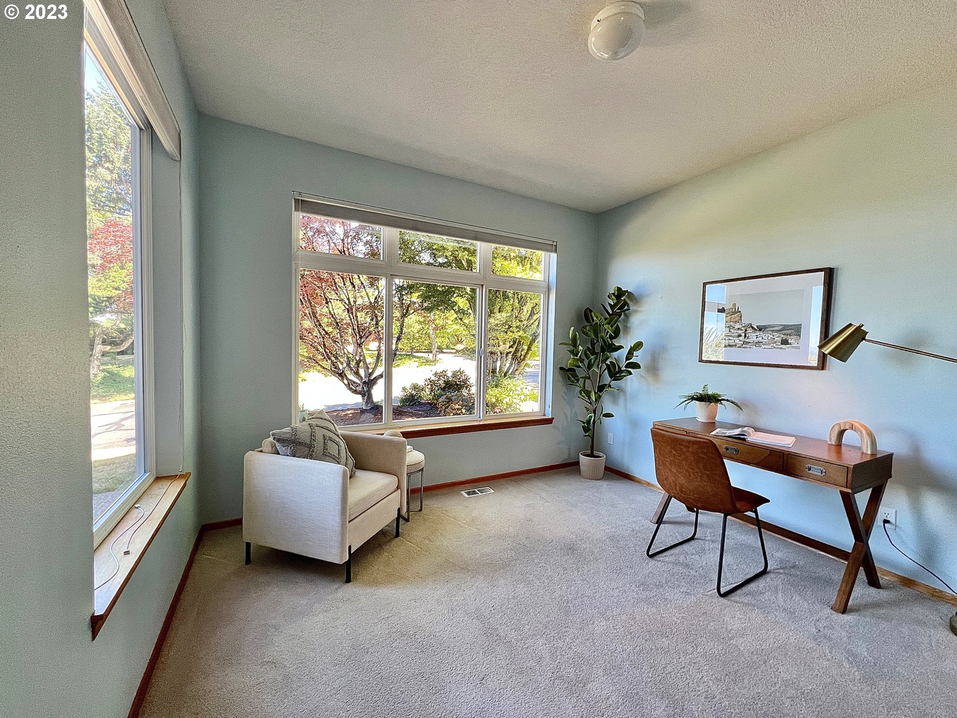 8208 Northwest Reed Drive Portland, OR 97229 - Photo 15 of 39 a living room with furniture and a large window