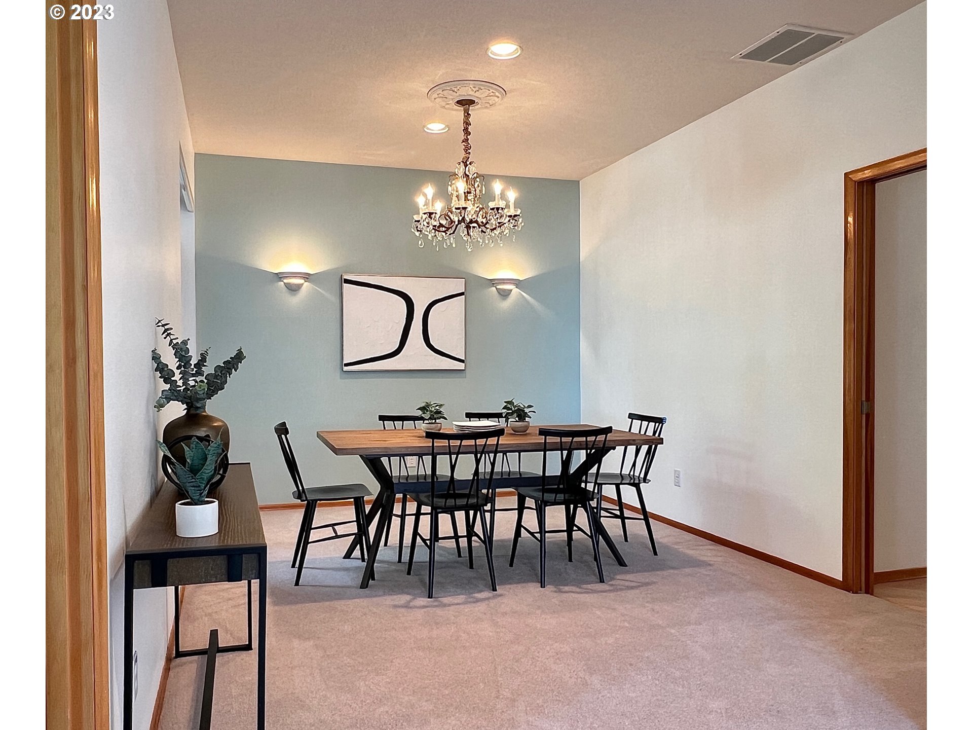 8208 Northwest Reed Drive Portland, OR 97229 - Photo 16 of 39 a view of a dining room with furniture and chandelier