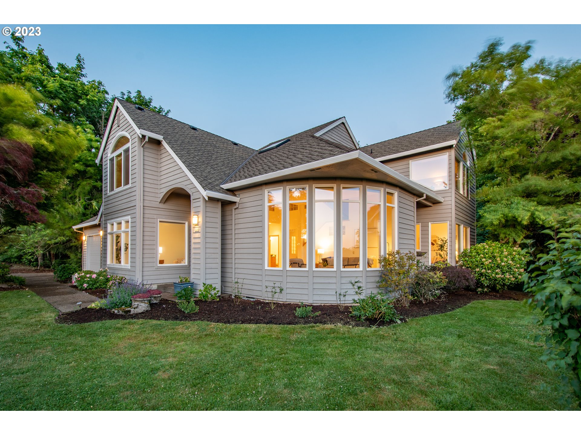 8208 Northwest Reed Drive Portland, OR 97229 - Photo 2 of 39 a front view of a house with a yard