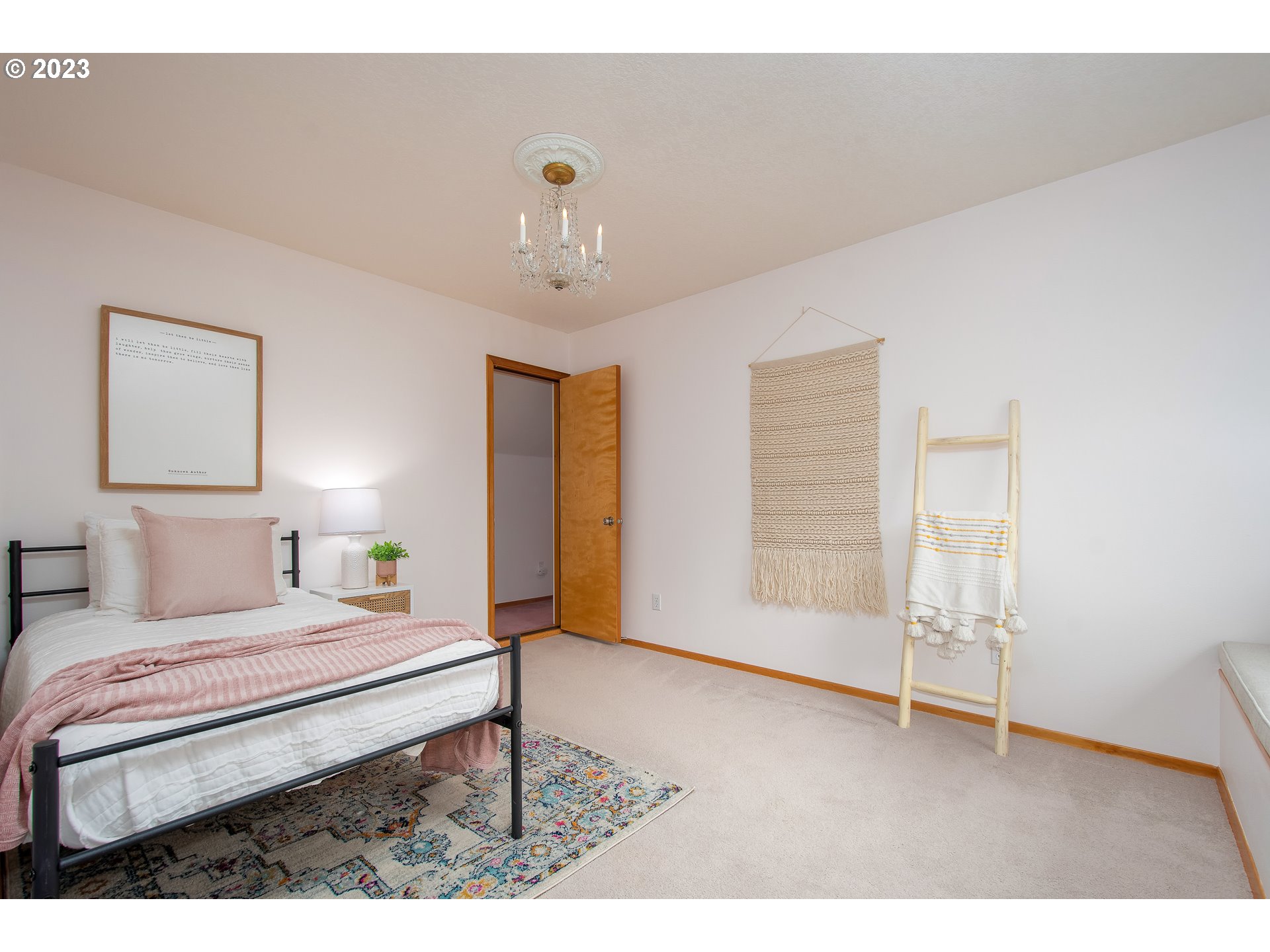 8208 Northwest Reed Drive Portland, OR 97229 - Photo 24 of 39 a bedroom with a bed and a view of bathroom