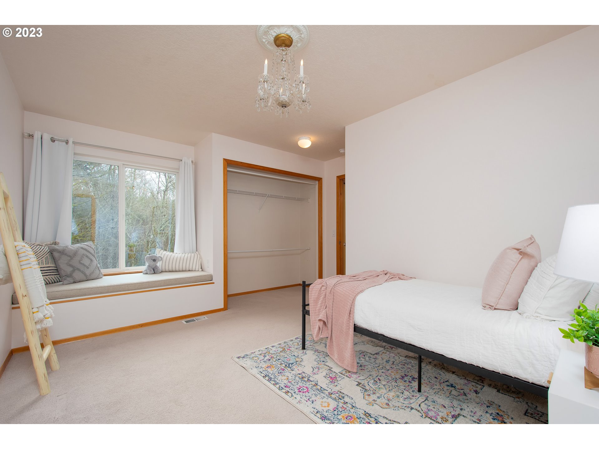 8208 Northwest Reed Drive Portland, OR 97229 - Photo 25 of 39 a bedroom with a bed and a window