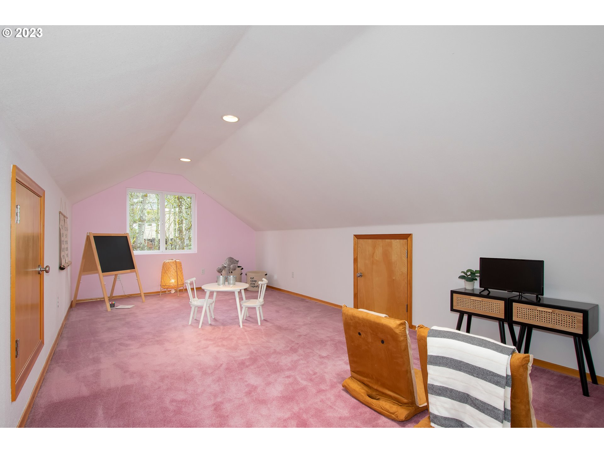 8208 Northwest Reed Drive Portland, OR 97229 - Photo 26 of 39 a living room with furniture and a window