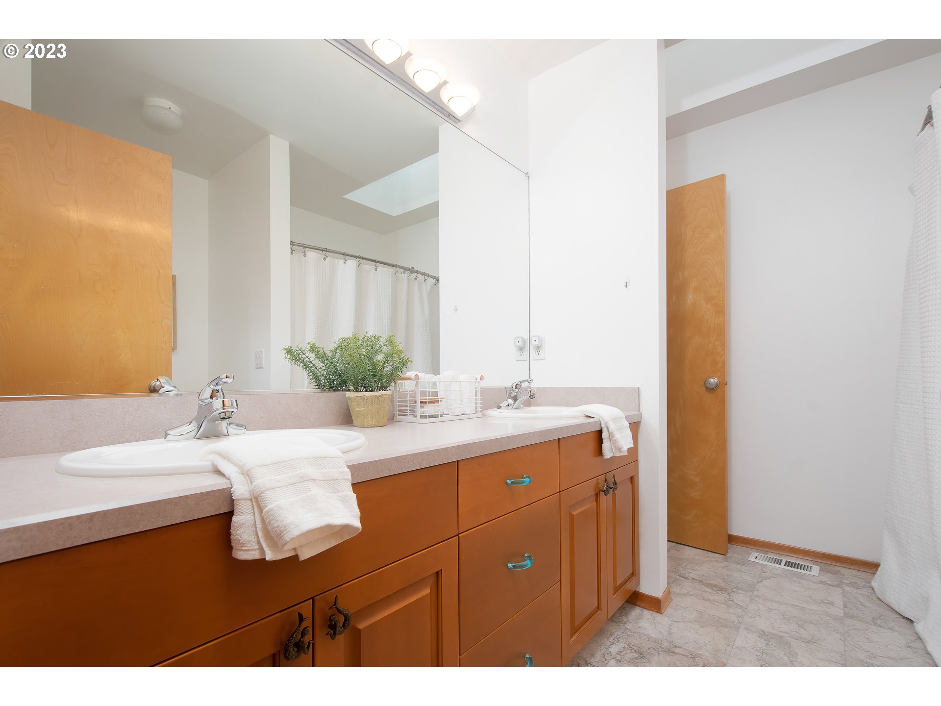 8208 Northwest Reed Drive Portland, OR 97229 - Photo 27 of 39 a bathroom with a granite countertop sink and a mirror