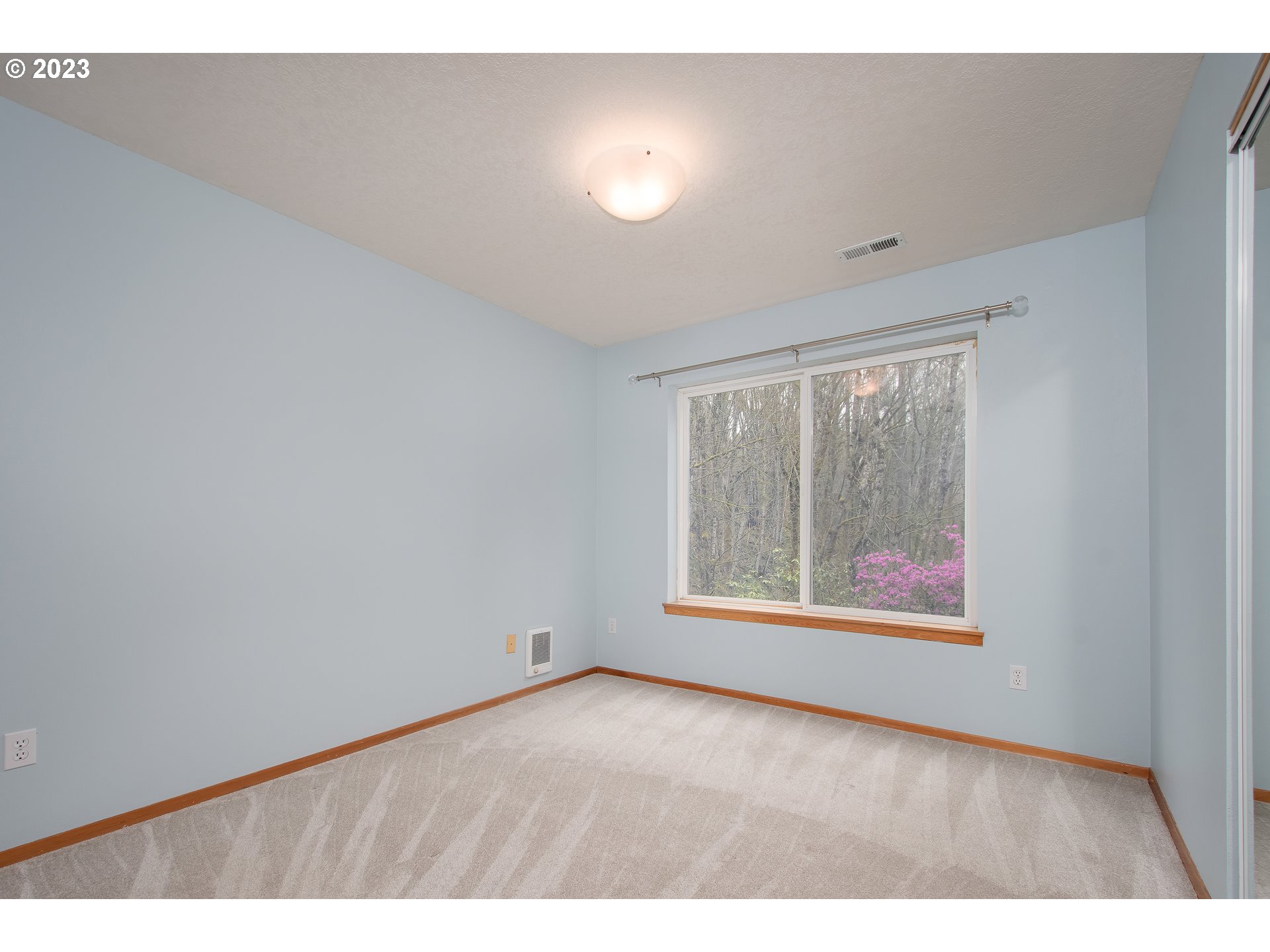 8208 Northwest Reed Drive Portland, OR 97229 - Photo 30 of 39 an empty room with windows and closet