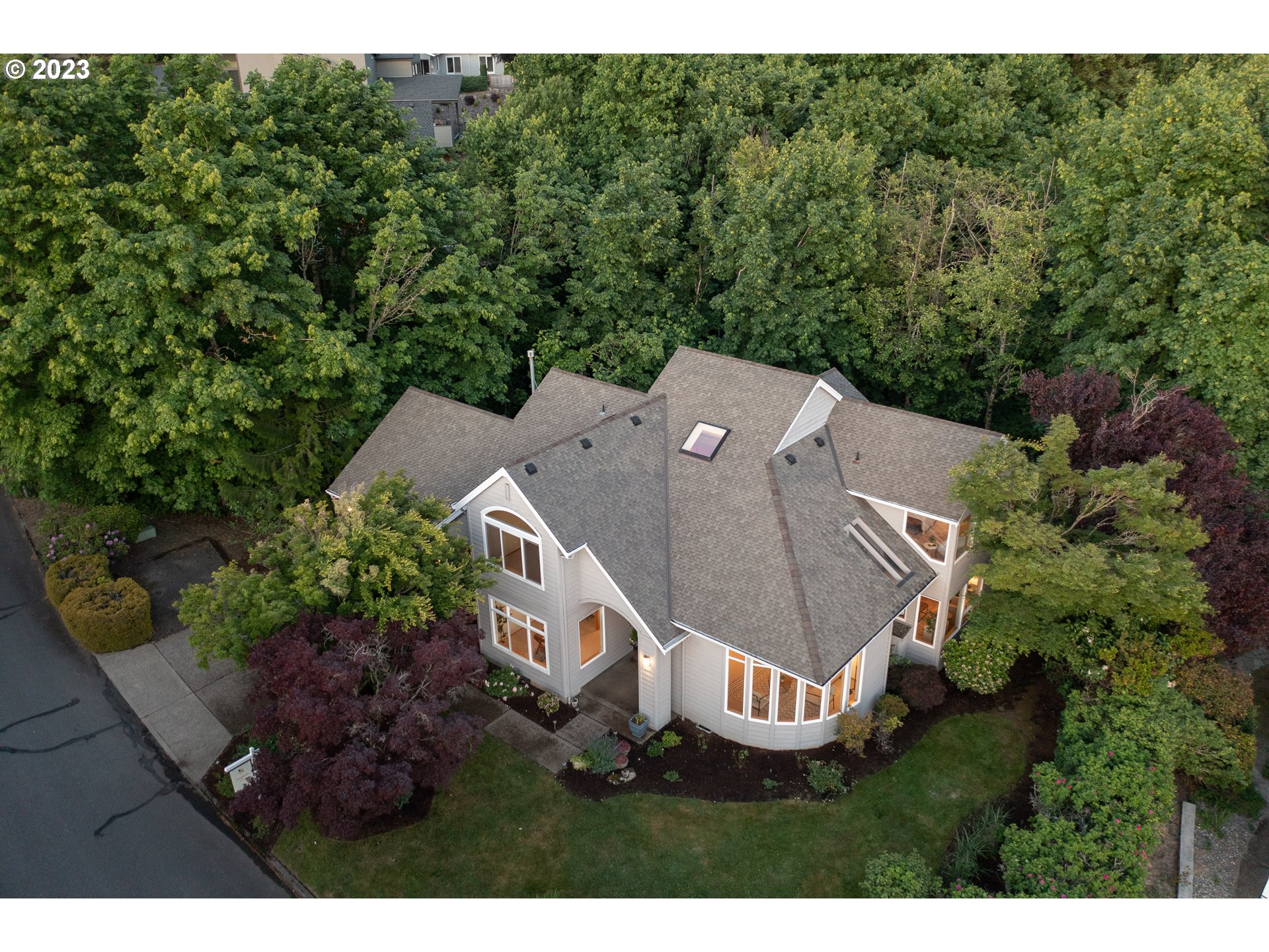 8208 Northwest Reed Drive Portland, OR 97229 - Photo 3 of 39 a view of a house with a yard