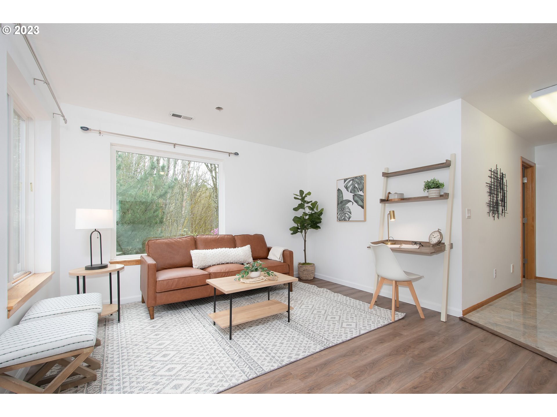 8208 Northwest Reed Drive Portland, OR 97229 - Photo 31 of 39 a living room with furniture and a large window