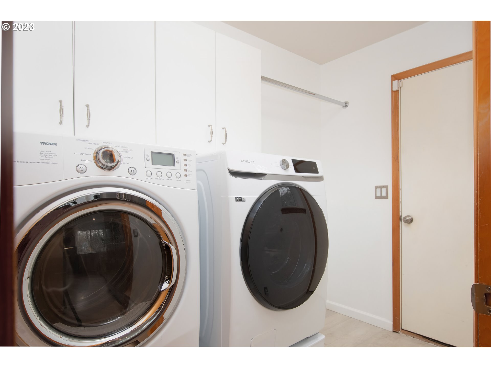 8208 Northwest Reed Drive Portland, OR 97229 - Photo 32 of 39 a view of a storage & utility room with dryer and washer