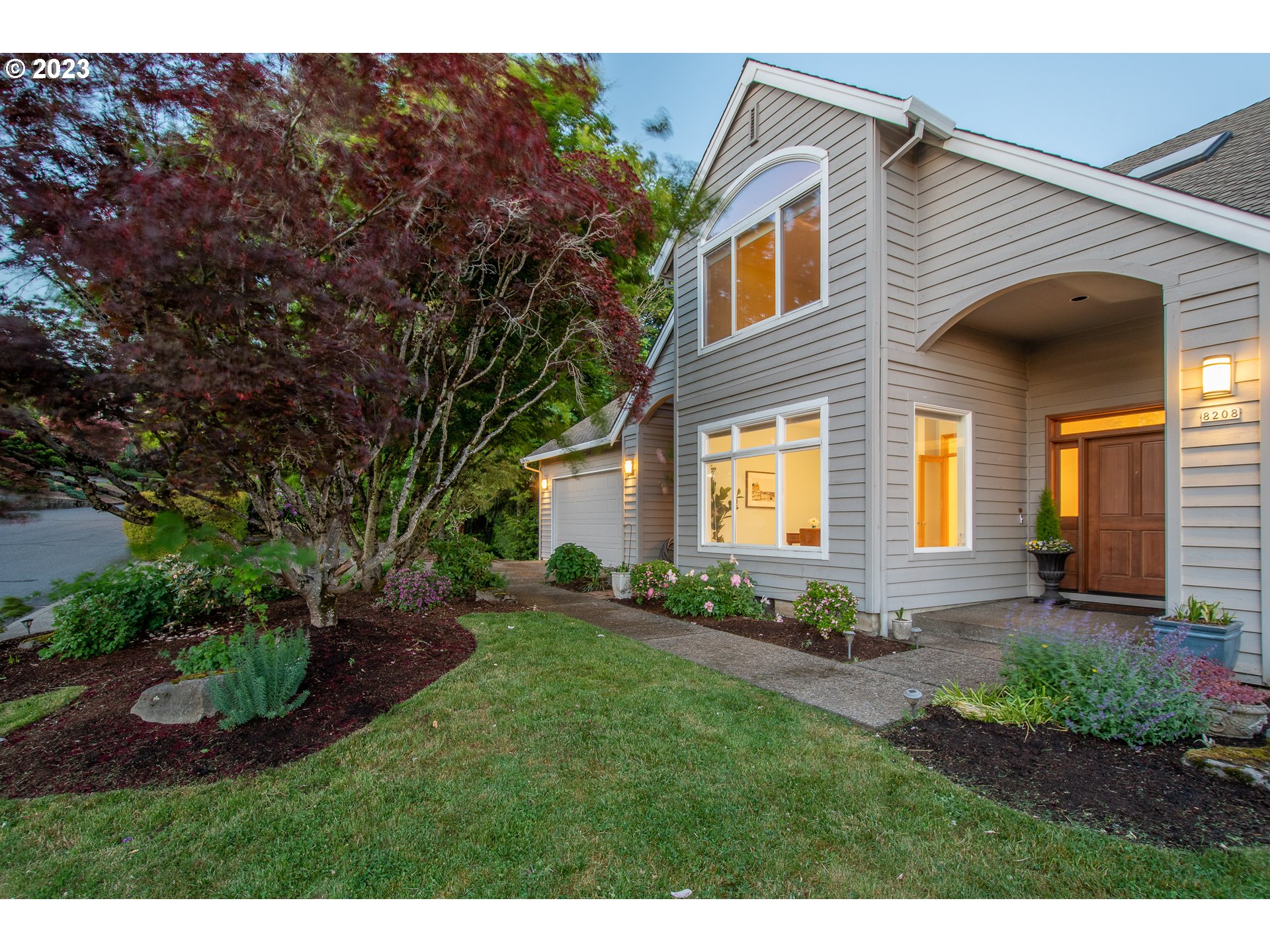8208 Northwest Reed Drive Portland, OR 97229 - Photo 5 of 39 a view of a house with a yard