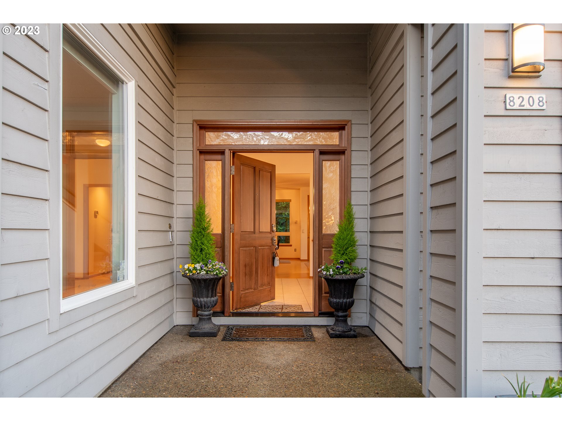 8208 Northwest Reed Drive Portland, OR 97229 - Photo 6 of 39 a living room with furniture and a potted plant