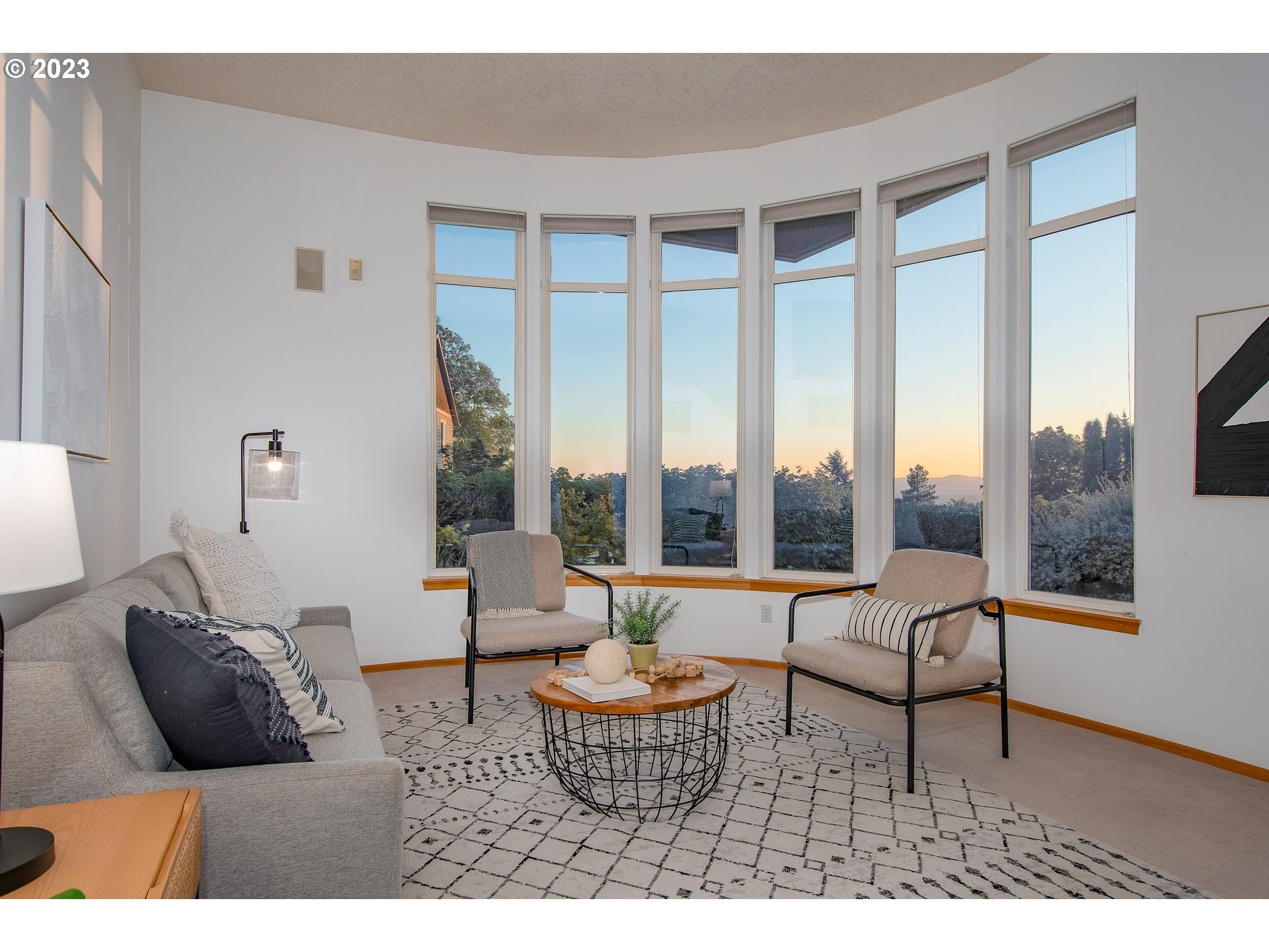 8208 Northwest Reed Drive Portland, OR 97229 - Photo 7 of 39 a living room with furniture and a large window