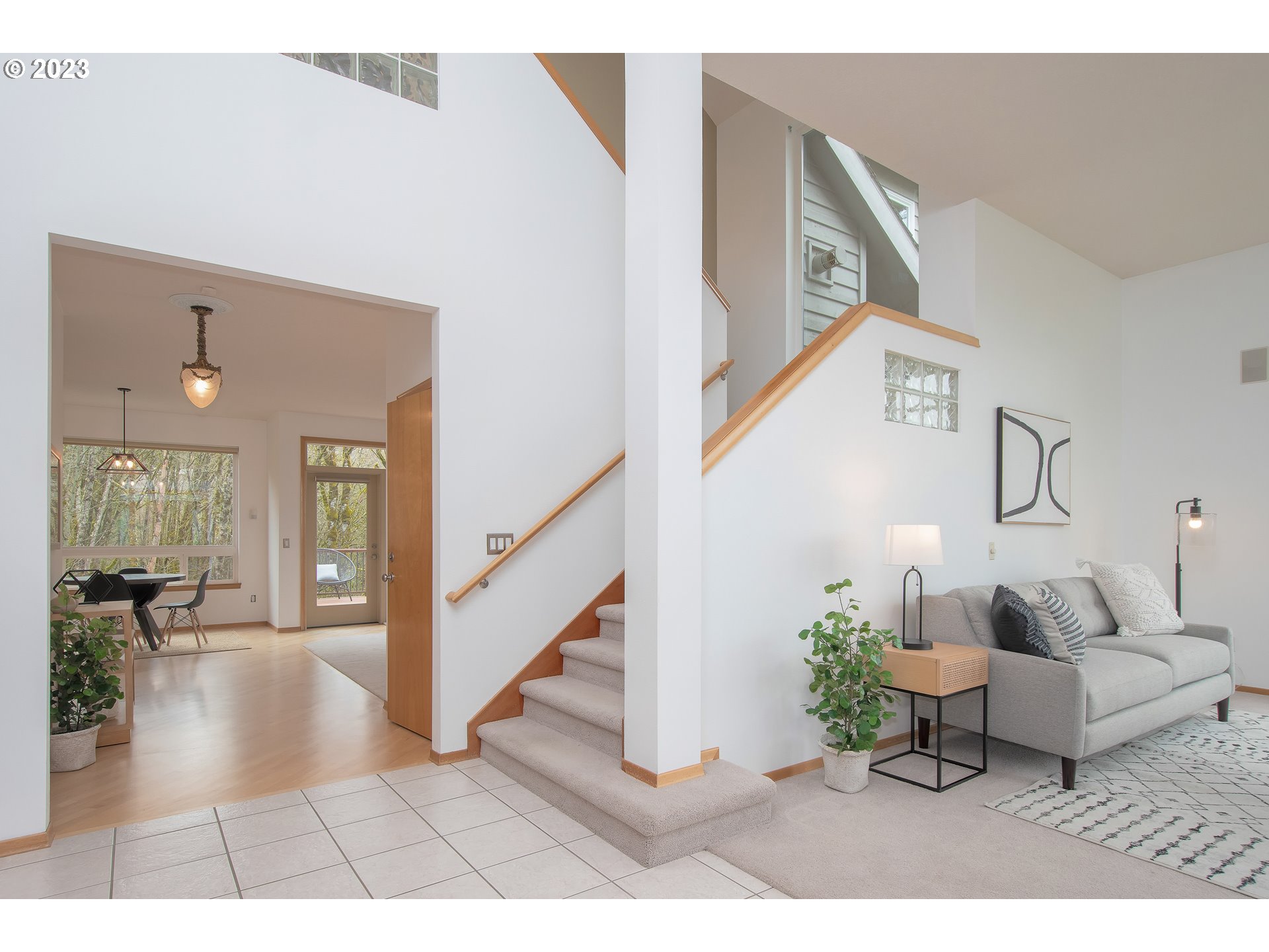 8208 Northwest Reed Drive Portland, OR 97229 - Photo 8 of 39 a living room with furniture and a wooden floor