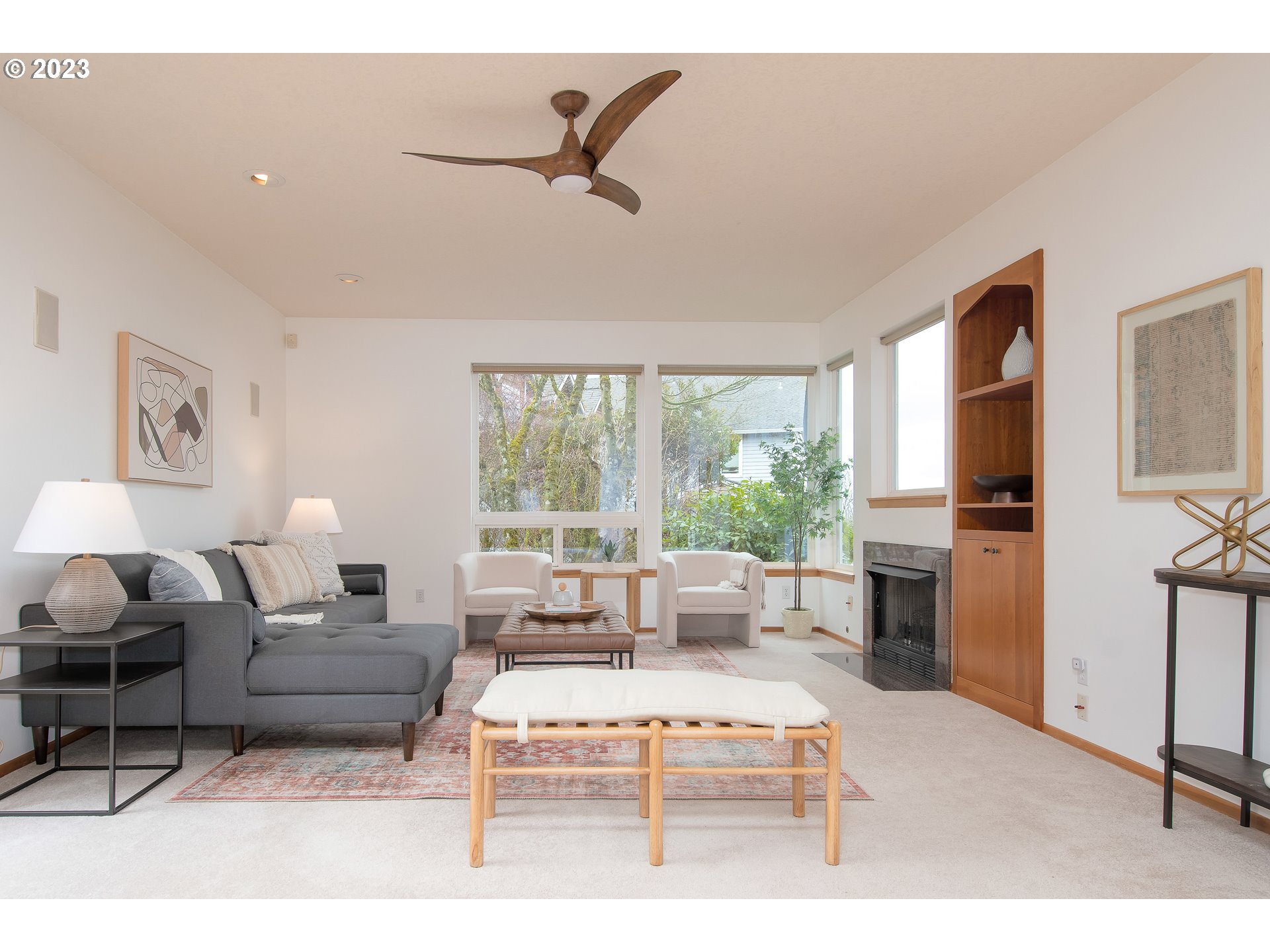 8208 Northwest Reed Drive Portland, OR 97229 - Photo 9 of 39 a living room with furniture and a flat screen tv