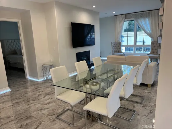a view of livingroom with furniture and flat screen tv