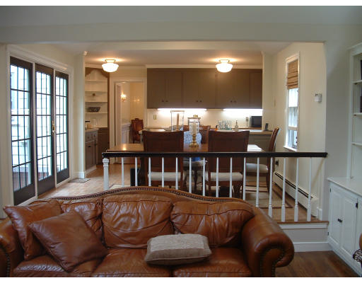 222 Boston Post Road Weston, MA 02493 - Photo 11 of 12 a living room with furniture and a floor to ceiling window