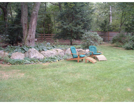 222 Boston Post Road Weston, MA 02493 - Photo 4 of 12 a backyard of a house with table and chairs
