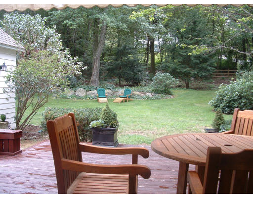 222 Boston Post Road Weston, MA 02493 - Photo 5 of 12 a patio with table and chairs and a yard