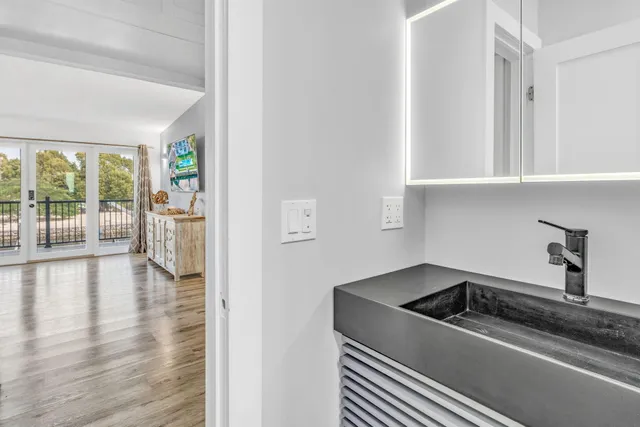 a kitchen with a refrigerator and a sink