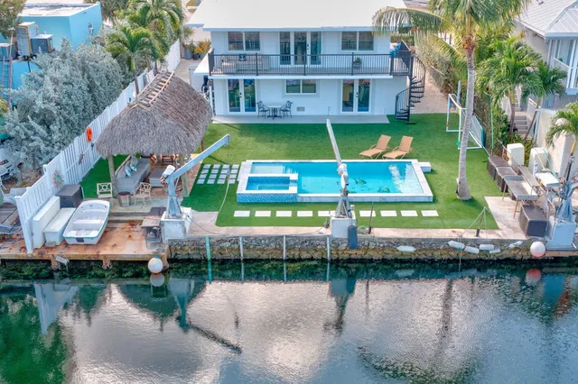 a aerial view of a house with a lake view