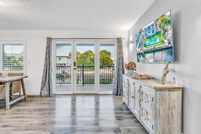 a view of an entryway with wooden floor