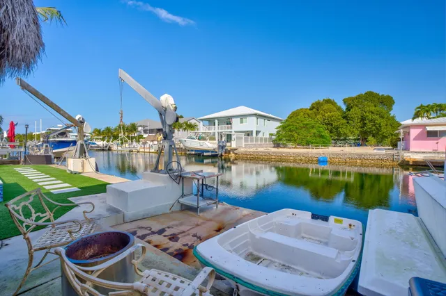 a view of a patio with chairs and a table