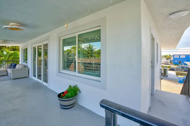 an aerial view of a house with a yard and a garage